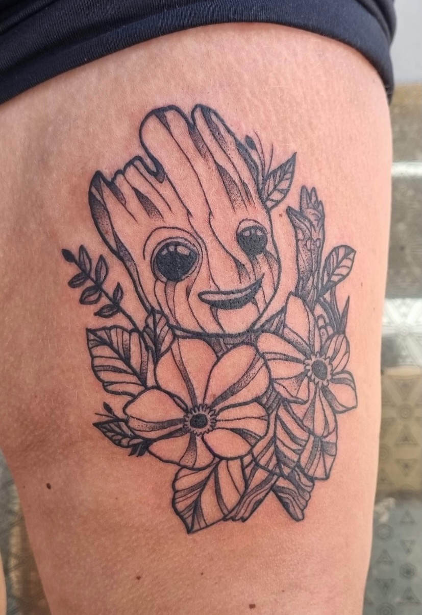 Baby Groot tattoo done on the inner forearm